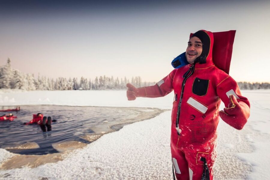 Daytime Ice Floating Rovaniemi, Frozen Lake Experience - The suit is the star: warmth, buoyancy, and comfort