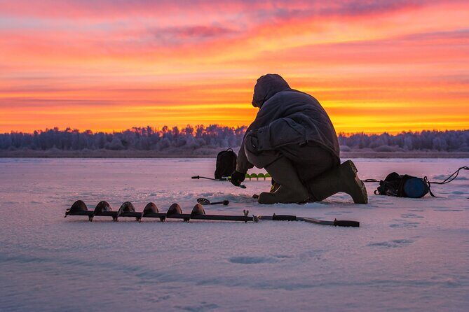 Lapland Ice Fishing Experience from Rovaniemi - The campfire meal: salmon, pork sausage, and warm breaks