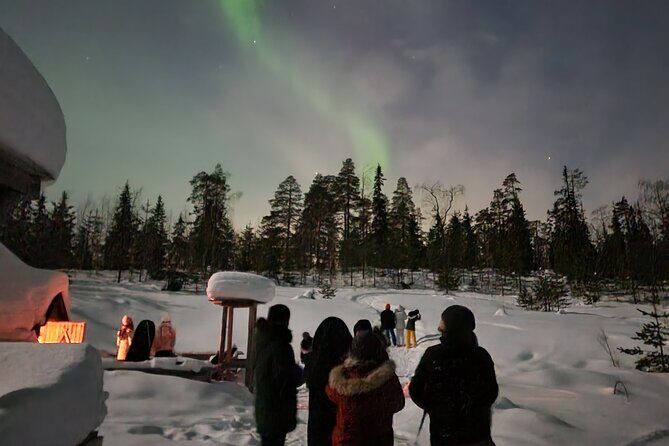 Lapland In A Day - Reindeer, Sledding, Snowmobile & Nature - Warming up at the open-fire hut with Lappish snacks